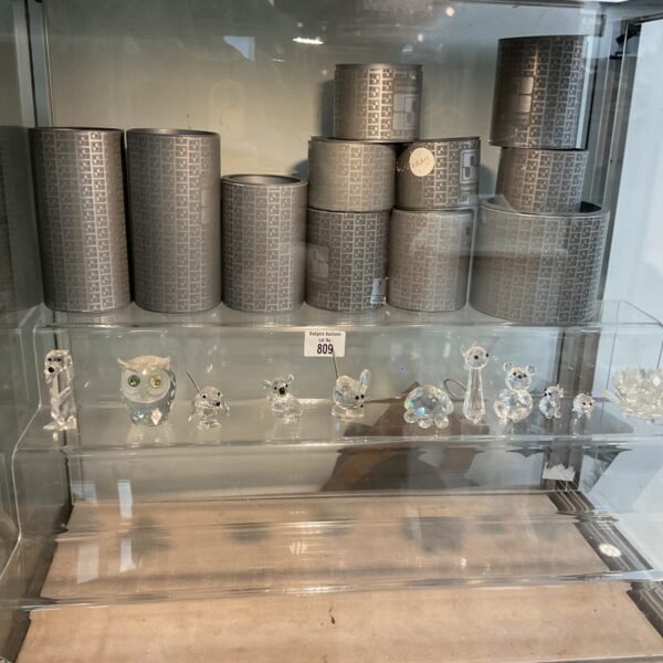 Eleven Swarovski crystal animal figurines in their original boxes.