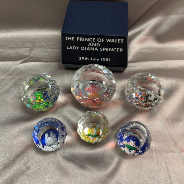 Six commemorative crystal paperweights celebrating the royal wedding.