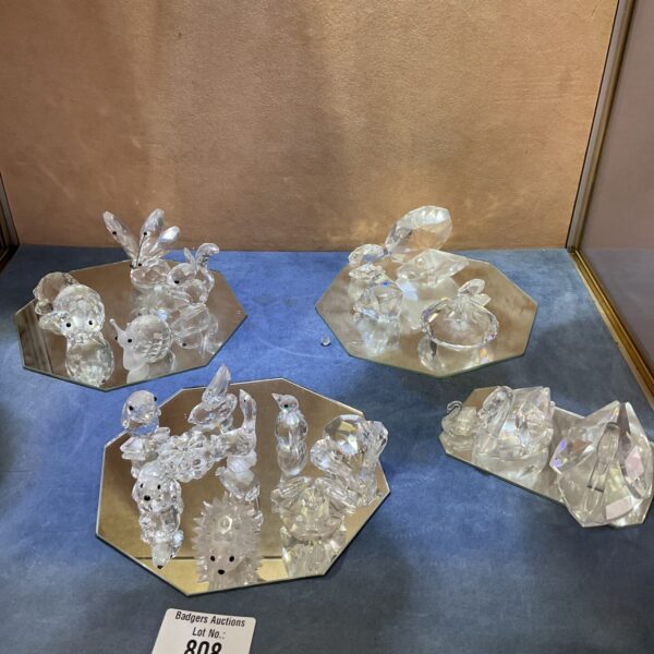 Close-up of a collection of sparkling Swarovski crystal animal figurines.