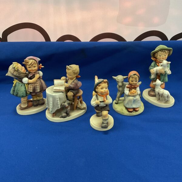 Vintage Goebel Hummel figures lot, collectible porcelain figurines.