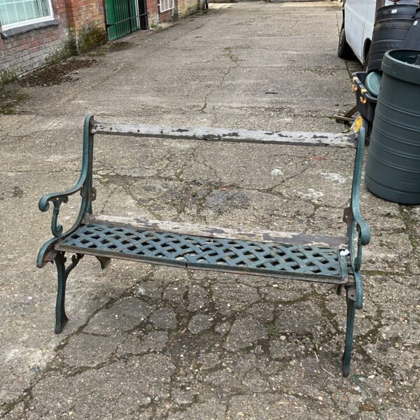 Antique wrought iron garden bench for restoration project.