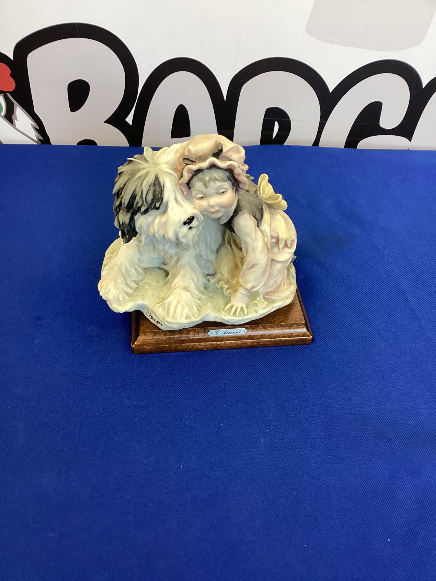 210 Porcelain ornament of a girl & her sheepdog signed G Armani