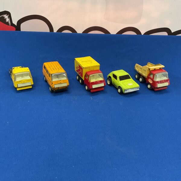 Vintage Tonka diecast trucks and vehicles in a lot.
