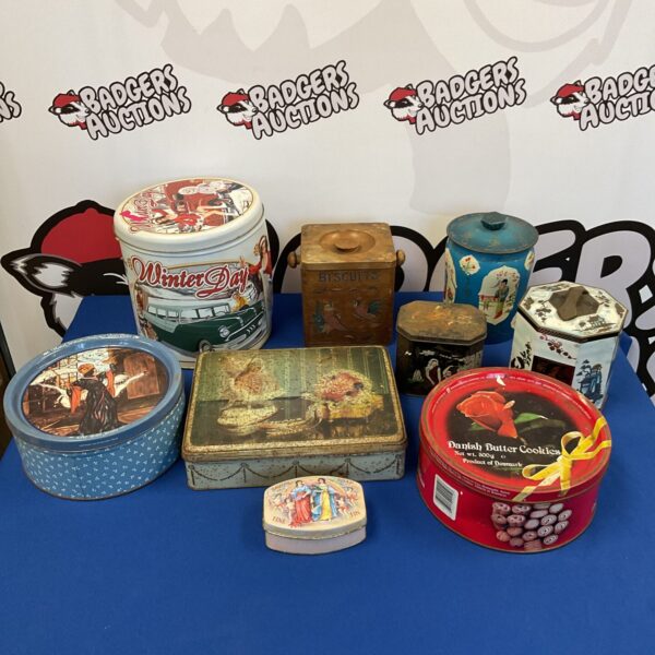 Vintage tin collection featuring colourful advertising designs.