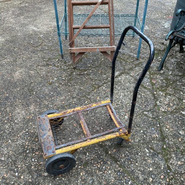 Vintage sack barrow trolley with metal frame and wheels.