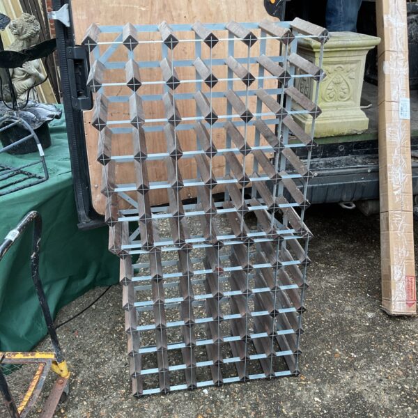 Dark metal 36 bottle wine rack for storage and display.