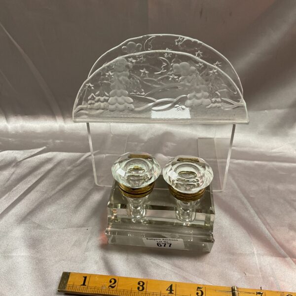 Antique German glass inkwell and letter rack on a white surface.