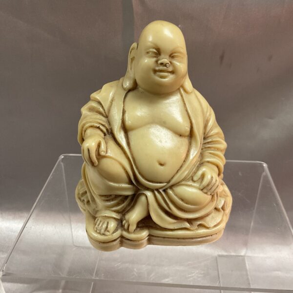 Ivory coloured resin Buddha statue for home decor.