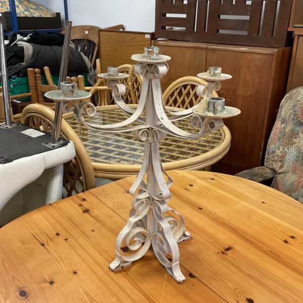 Ornate vintage wrought iron candelabra with multiple arms.