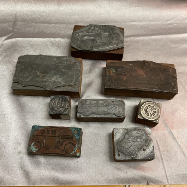 Vintage car printing blocks lot featuring Triumph and Fiat designs.