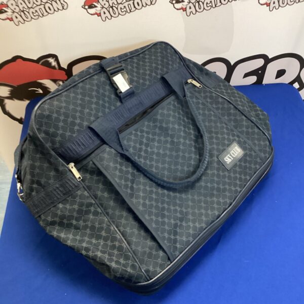 Navy blue Sky Club wheeled holdall with patterned design.