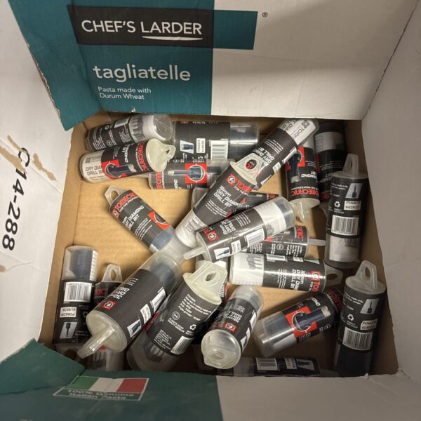 Assorted Tomecanic diamond drill bits in original packaging.