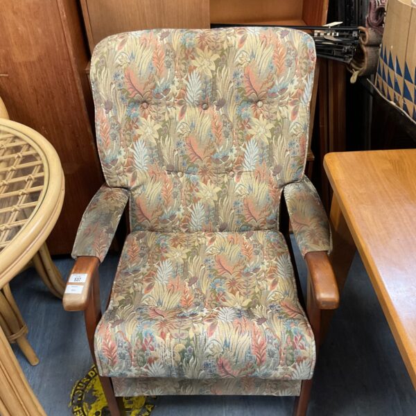 Vintage Gplan floral armchair in a patterned fabric.