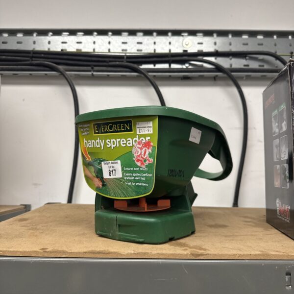 Green Evergreen handy seed spreader for garden use.
