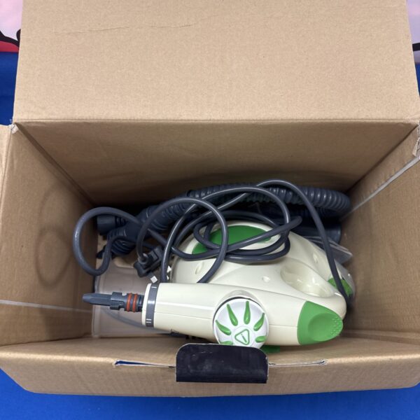 Vaporettino steam cleaner inside cardboard box, vintage appliance.