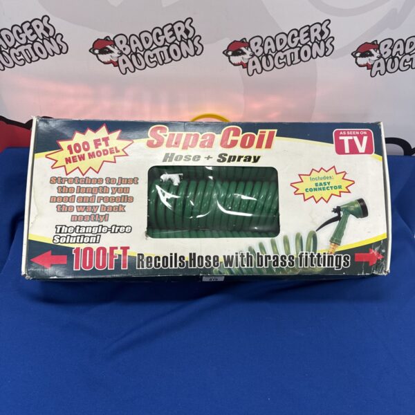 Vintage Supacoil garden hose with recoiling mechanism for easy storage.