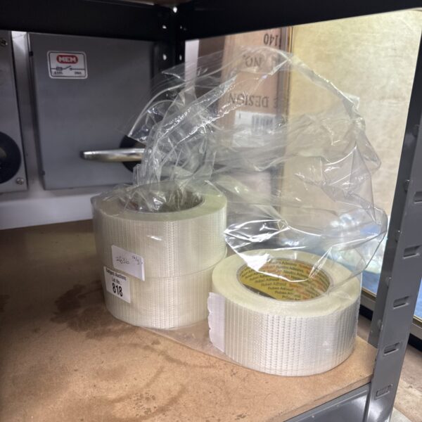 Sealed rolls of clear scotch tape for office use.