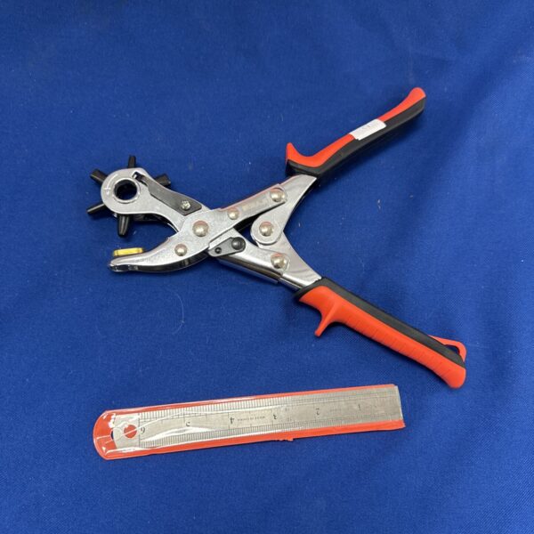 Airaj fabric hole punch with integrated 6 inch metal ruler.