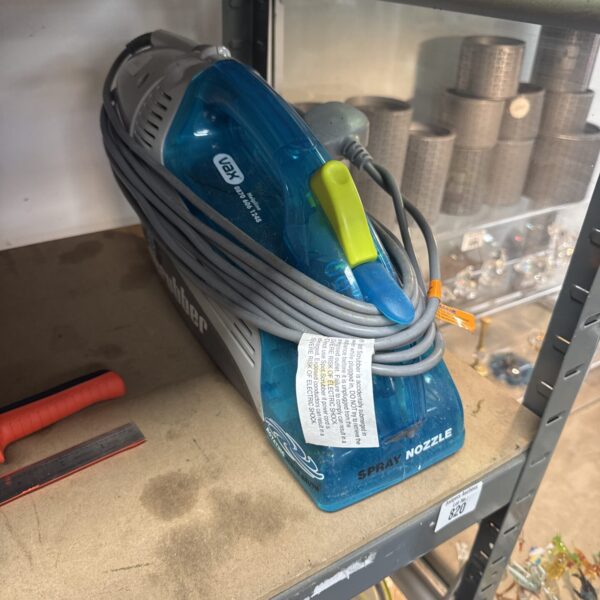 Vax Spot Scrubber handheld carpet and upholstery cleaner.