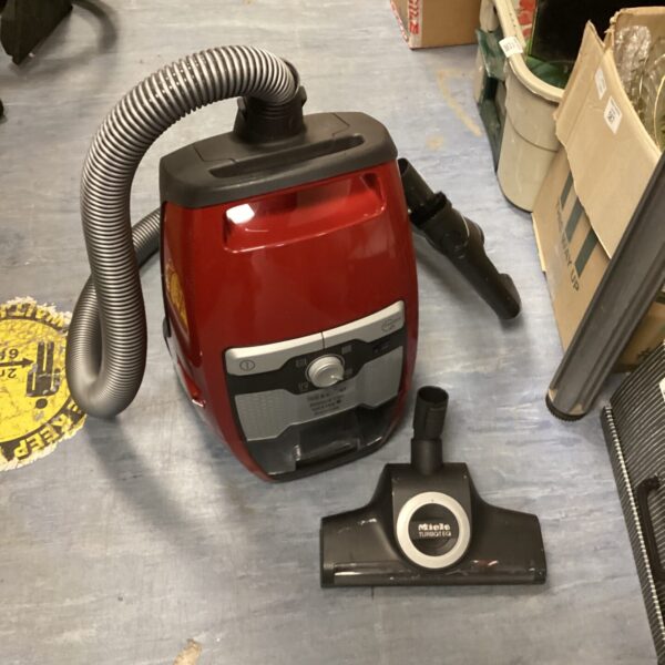 Red Miele Blizzard CX1 cat & dog vacuum cleaner, cylinder style.