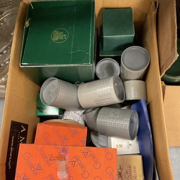 Large lot of empty Swarovski and Hummel collectible boxes.