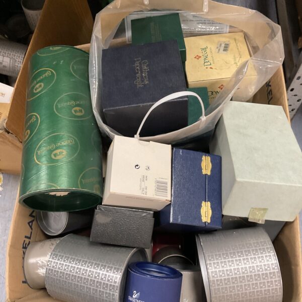 Collection of empty Swarovski and Caithness presentation boxes.