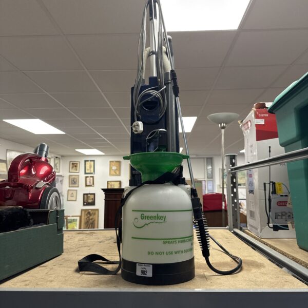Vintage Greenkey garden sprayer with a large tank and spray wand.