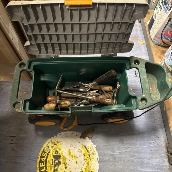 Vintage Zag wheeled garden toolbox filled with gardening tools.