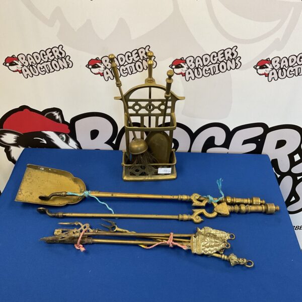 Vintage brass fireside companion set with ornate detailing.