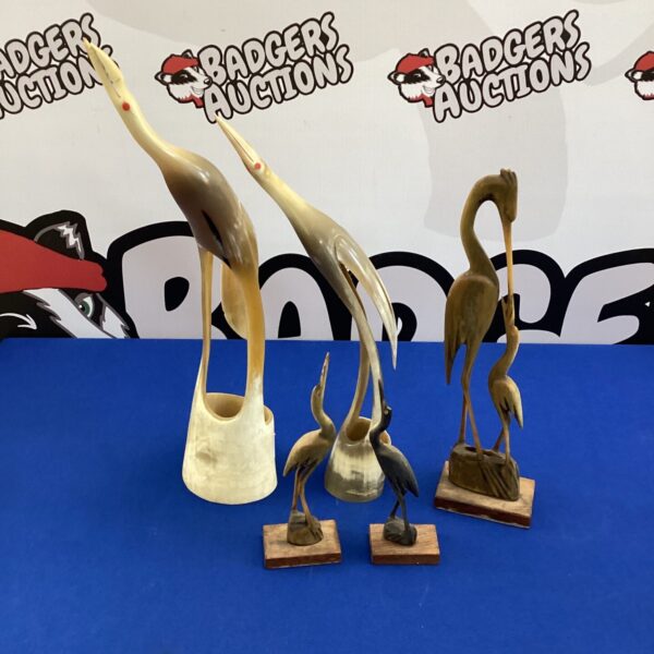 Set of vintage horn and wood crane bird ornaments for collectors.