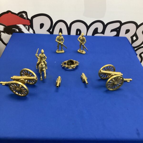 Vintage brass cannon model, detailed collectible artillery piece.