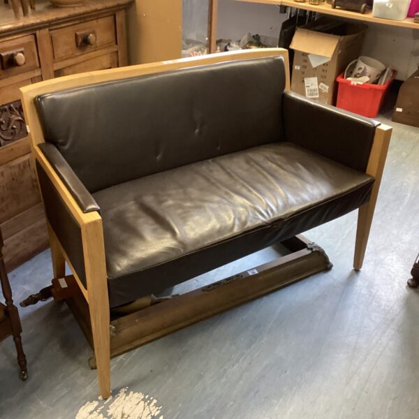 Leather bench with oak frame, originally from Cartier London.