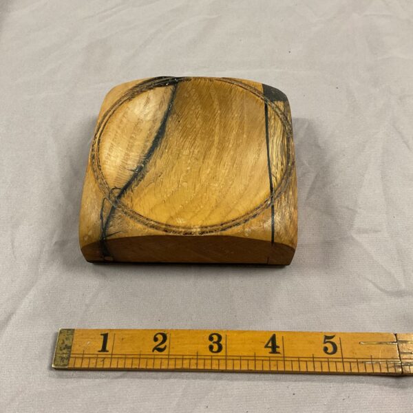 Front view of HMS Victory oak pin tray, showing wood grain.