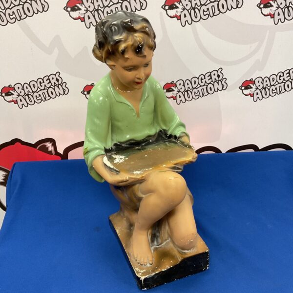 Vintage shop counter display boy, a collectible store fixture.
