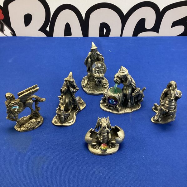 Detailed pewter mythical figures lot including dragons and wizard.