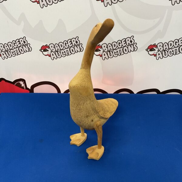 Hand-carved wooden duck ornament for rustic home décor.