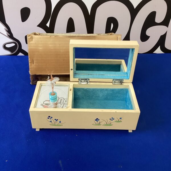 Vintage ballerina jewellery box with rotating figurine and musical movement.
