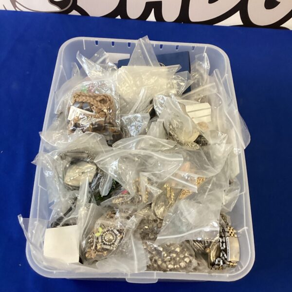 Large lot of assorted costume jewellery in a clear plastic box.