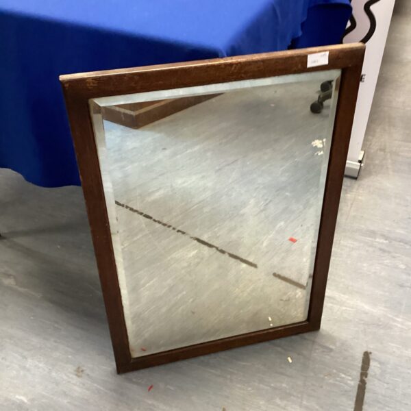 Vintage wooden framed mirror for wall decor.