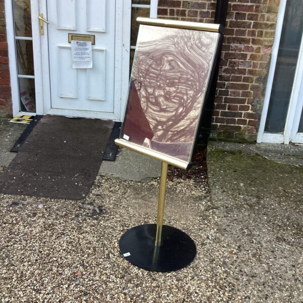 Gold-framed freestanding noticeboard for office reception display.