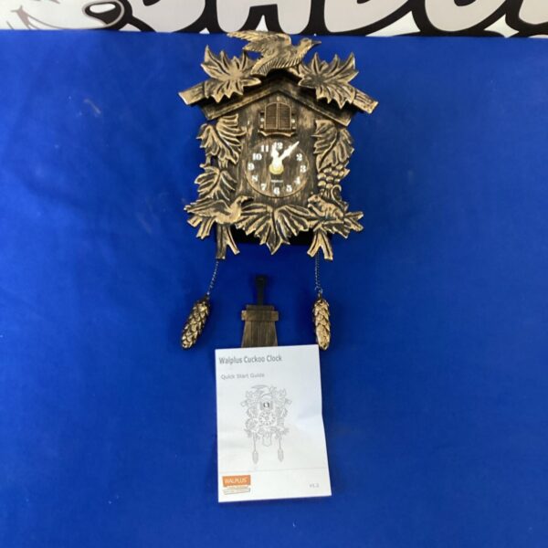 Vintage Walplus cuckoo clock with chalet detailing.
