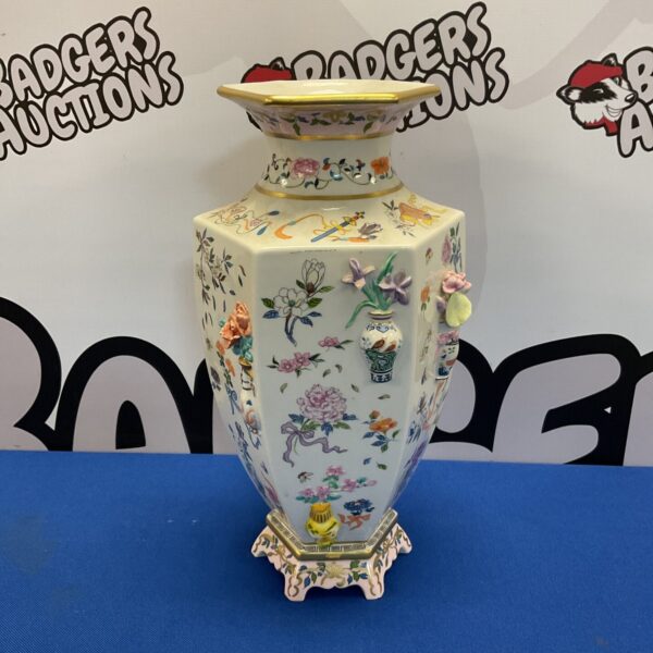 Intricate floral design on a beautiful antique Wang vase.