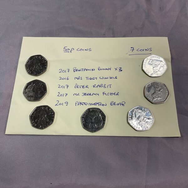 Lot of seven Beatrix Potter 50p coins, collectable British currency.