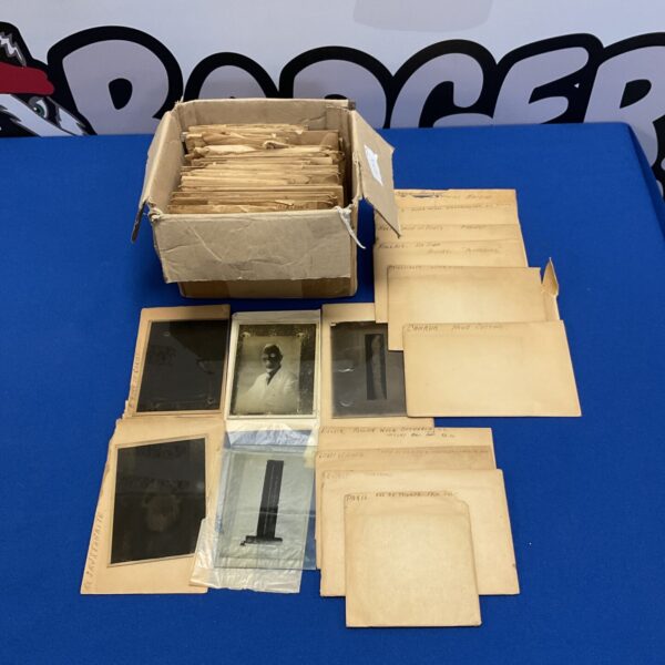Antique magic lantern slides and index cards in a box.
