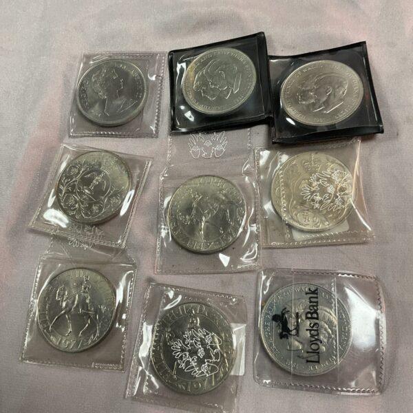 Collection of nine silver plated commemorative coins.