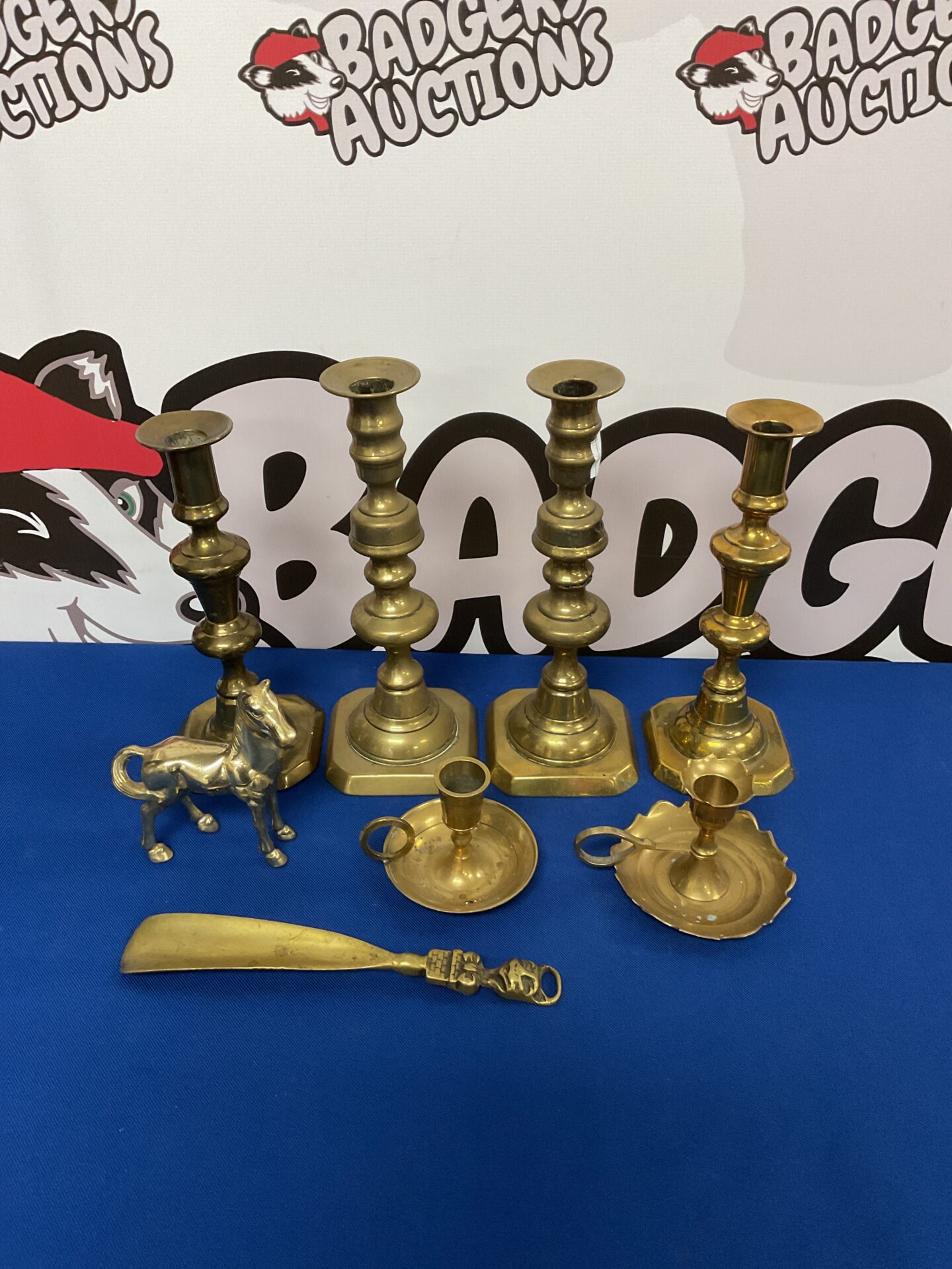 052 Two pairs of brass candlesticks with chamber-sticks & shoe horn