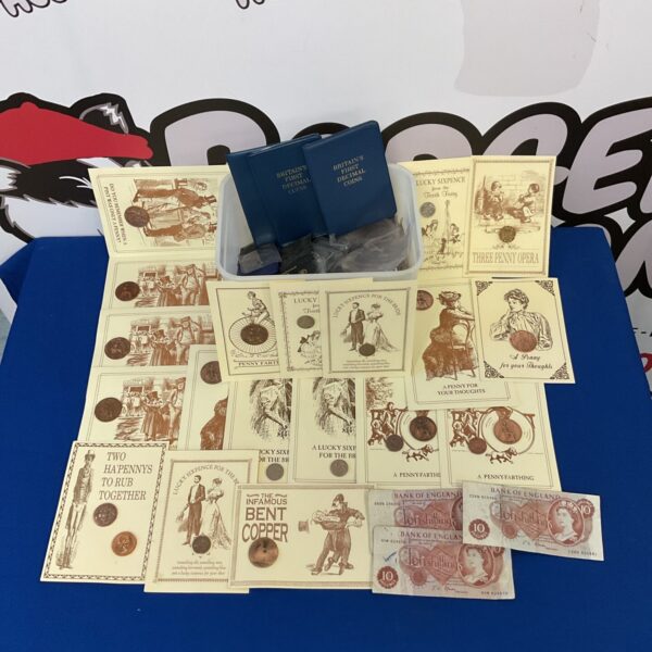 Vintage British coin and note collection with coin sleeves.