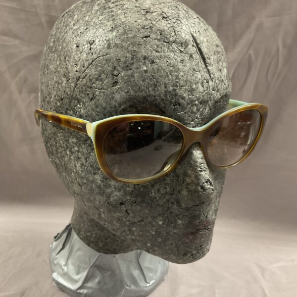 Vintage Tiffany & Co cat-eye sunglasses with amber frame.