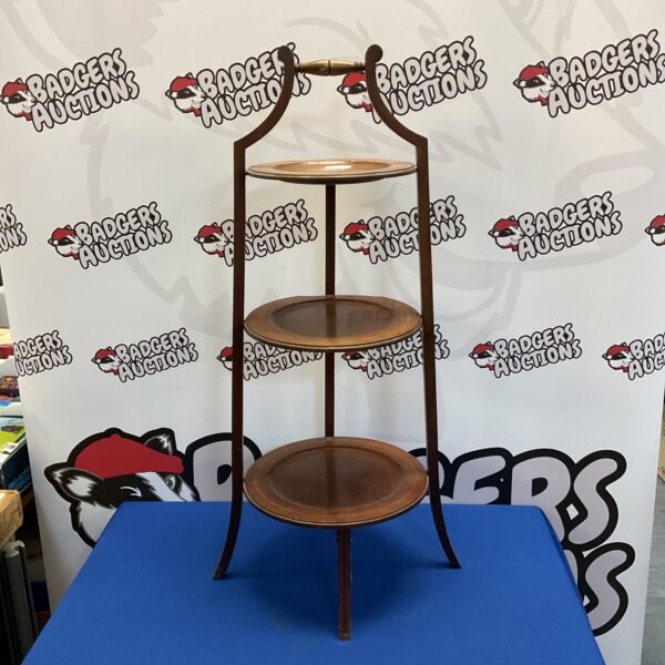 Elegant vintage mahogany three-tier cake stand for serving.
