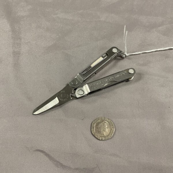 Open Leatherman Micra multi-tool showing various tools.